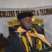 Starz University founder Ambassador Latim Da-Thong delivers a speech in academic regalia during a commencement ceremony, supporting NCHE reforms in Liberia’s higher education sector.
