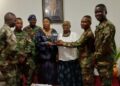 Liberian Ambassador Musu Yartu Ruhle and officials pose with Armed Forces of Liberia music graduates during a recognition ceremony in Accra, Ghana.