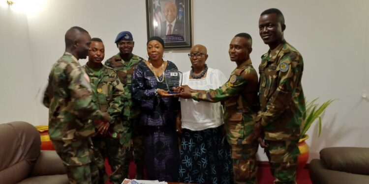 Liberian Ambassador Musu Yartu Ruhle and officials pose with Armed Forces of Liberia music graduates during a recognition ceremony in Accra, Ghana.