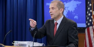 U.S. Ambassador addressing immigration concerns during a press briefing, calling for economic reforms in Liberia to curb visa overstays.