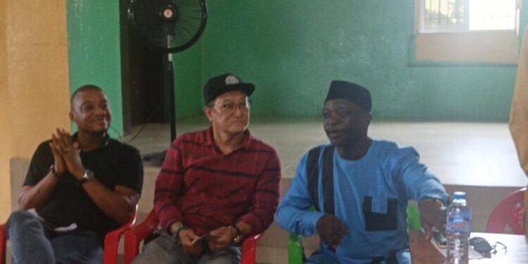 Community members and Vision Africa Mining representatives discuss proposed black sand project in Marshall City, Liberia