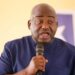 Rep. Musa Hassan Bility speaks into a microphone during a press appearance in Monrovia, calling for a Legislature audit and criticizing President Boakai over the Koffa arson trial.