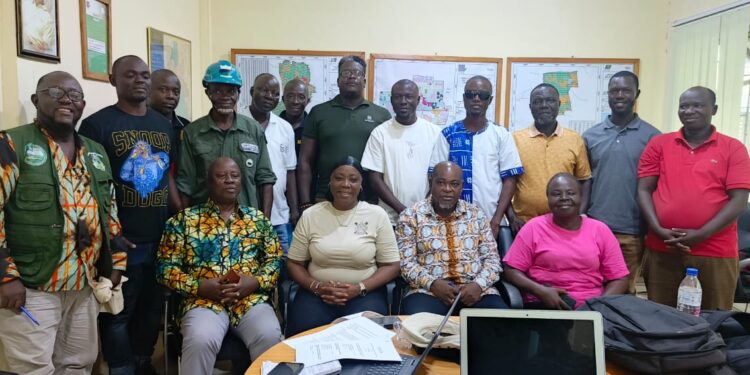 NBC officials and representatives from government institutions pose in Maryland County during a compliance review of MOPP and CRC concessions.