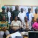 NBC officials and representatives from government institutions pose in Maryland County during a compliance review of MOPP and CRC concessions.