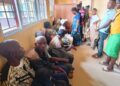 Citizens waiting in long lines at the National Identification Registry (NIR) enrollment center in Gbarnga, Bong County, Liberia