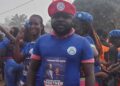 Prince Yeah wearing CDC regalia at a political event before resigning from the party to join Unity Party in Nimba County, Liberia.