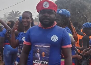 Prince Yeah wearing CDC regalia at a political event before resigning from the party to join Unity Party in Nimba County, Liberia.