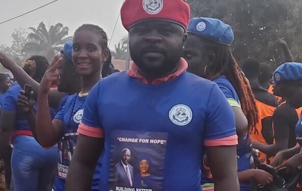 Prince Yeah wearing CDC regalia at a political event before resigning from the party to join Unity Party in Nimba County, Liberia.