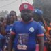 Prince Yeah wearing CDC regalia at a political event before resigning from the party to join Unity Party in Nimba County, Liberia.