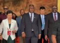 PPCC Executive Director Bodger Scott Johnson walks with Vice President Jeremiah Koung and officials in China during a vendor inspection visit, raising conflict of interest concerns.