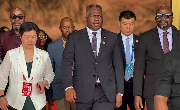 PPCC Executive Director Bodger Scott Johnson walks with Vice President Jeremiah Koung and officials in China during a vendor inspection visit, raising conflict of interest concerns.