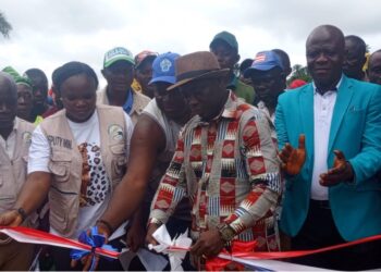President Joseph Boakai and officials cut ribbon during the launch of the restored Fagonda Dam and $650,000 irrigation project in Wahansa, Lofa County