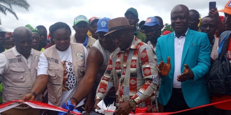 President Joseph Boakai and officials cut ribbon during the launch of the restored Fagonda Dam and $650,000 irrigation project in Wahansa, Lofa County