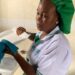 Princess L. Bloar cleaning dishes at work