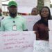 Unity Party supporters in Bong County hold protest signs at the Gbarnga Administration Building demanding the resignation of Superintendent Hawa Norris for alleged betrayal and marginalization