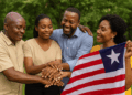 AI-generated image showing four smiling Liberian individuals—two men and two women—standing outdoors in a circle with their hands joined in a gesture of unity and reconciliation. One woman holds a visible Liberian flag, symbolizing national peace and healing, with lush green trees in the background.