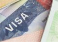 Close-up image of a U.S. visa page, symbolizing immigration policy and travel restrictions under new executive orders, as Liberia is exempted from the 2025 Trump visa ban.