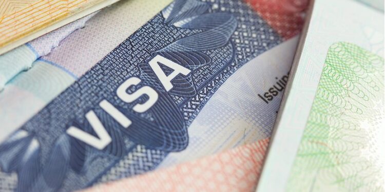 Close-up image of a U.S. visa page, symbolizing immigration policy and travel restrictions under new executive orders, as Liberia is exempted from the 2025 Trump visa ban.