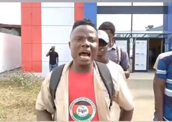 University of Liberia student and SUP member shouts during protest at Liberia Football Association headquarters in Monrovia