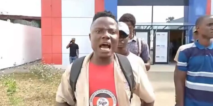 University of Liberia student and SUP member shouts during protest at Liberia Football Association headquarters in Monrovia