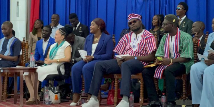 Interim UL student president J. Blio Tingbah in dark glasses and traditional suit