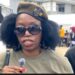 Veronica Mamie Doe speaks to the media wearing dark sunglasses and a military-style beret as controversy erupts over her public allegations against the Doe family.