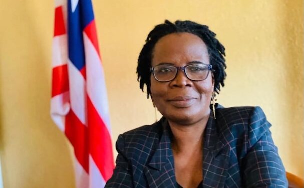 Attorney Victoria Duncan seated near Liberian flag, nominated as Resident Judge of the 13th Judicial Circuit by President Joseph Boakai.