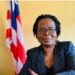 Attorney Victoria Duncan seated near Liberian flag, nominated as Resident Judge of the 13th Judicial Circuit by President Joseph Boakai.