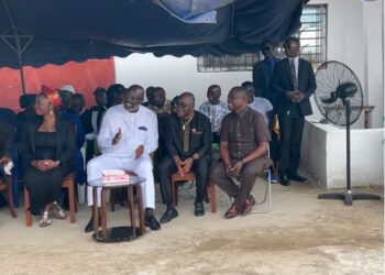 Former President George Weah seated among mourners at the home of late First Lady Nancy Doe, offering condolences to the bereaved family in Sinkor, Monrovia.