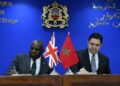 UK Foreign Secretary David Lammy and Moroccan Foreign Minister Nasser Bourita sign a joint communiqué in Rabat, seated at a desk with the UK and Moroccan flags displayed, under the Moroccan Ministry of Foreign Affairs emblem.
