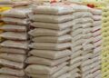 Bags of imported rice stacked in a warehouse