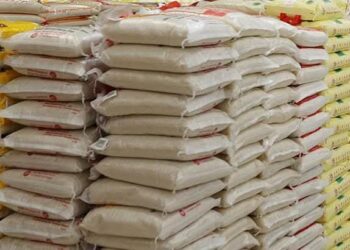 Bags of imported rice stacked in a warehouse
