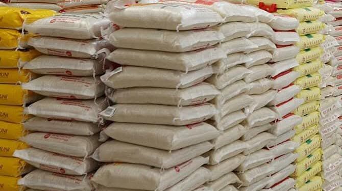 Bags of imported rice stacked in a warehouse
