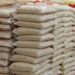 Bags of imported rice stacked in a warehouse