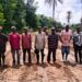 Local leaders and engineers stand on a newly cleared road section in Zota District, Bong County, marking progress on a six-kilometer community-led project.