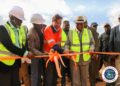 President Joseph Boakai, ArcelorMittal executives, and officials cut ribbon to inaugurate the $1.8 billion iron ore concentrator plant in Tokadeh, Nimba County.