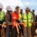 President Joseph Boakai, ArcelorMittal executives, and officials cut ribbon to inaugurate the $1.8 billion iron ore concentrator plant in Tokadeh, Nimba County.