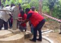 Liberia Red Cross staff dedicate a newly constructed hand pump in Sarwolor Town, Bong County, as community members celebrate access to clean water.