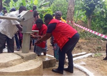 Liberia Red Cross staff dedicate a newly constructed hand pump in Sarwolor Town, Bong County, as community members celebrate access to clean water.