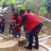 Liberia Red Cross staff dedicate a newly constructed hand pump in Sarwolor Town, Bong County, as community members celebrate access to clean water.