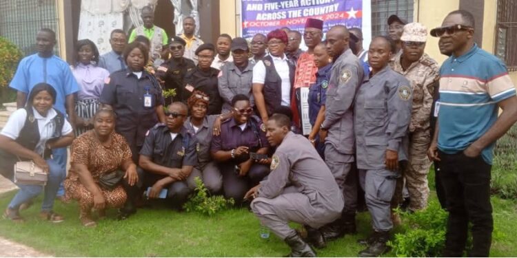 Group photo of Justice Ministry officials, security officers, and local leaders in Grand Gedeh County during the launch of the Gender Policy and Five-Year Action Plan at Tubman Palace.