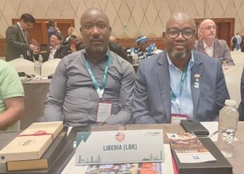 Gbassay Golee, President of the Liberia National Table Tennis Association, sits beside a delegate at the 2025 ITTF Elective Congress in Doha, Qatar, where Liberia regained its active member status after 13 years of inactivity.