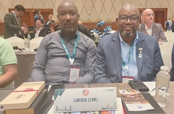 Gbassay Golee, President of the Liberia National Table Tennis Association, sits beside a delegate at the 2025 ITTF Elective Congress in Doha, Qatar, where Liberia regained its active member status after 13 years of inactivity.