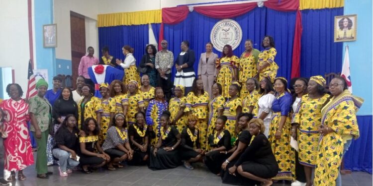 Liberian women lecturers and supporters at the launch of AUWOL-Liberia, advocating for gender equality in higher education at the University of Liberia auditorium.