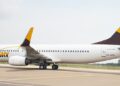 ASKY Airlines Boeing 737 aircraft taxiing on runway at Roberts International Airport in Liberia