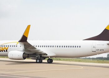 ASKY Airlines Boeing 737 aircraft taxiing on runway at Roberts International Airport in Liberia