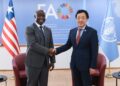 FAO Director-General Qu Dongyu and Liberia’s Agriculture Minister J. Alexandar Nuetah shake hands at the launch of the Liberia Situation Room in Rome
