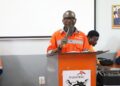 Amos T. Daywhea speaks during ArcelorMittal Liberia training academy enrollment ceremony in Yekepa