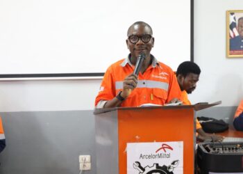 Amos T. Daywhea speaks during ArcelorMittal Liberia training academy enrollment ceremony in Yekepa