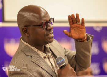 Deputy Sports Minister G. Andy Quamie speaks at CAF coaching course graduation, urging unity in Liberian football amid criticism of his past leadership role.